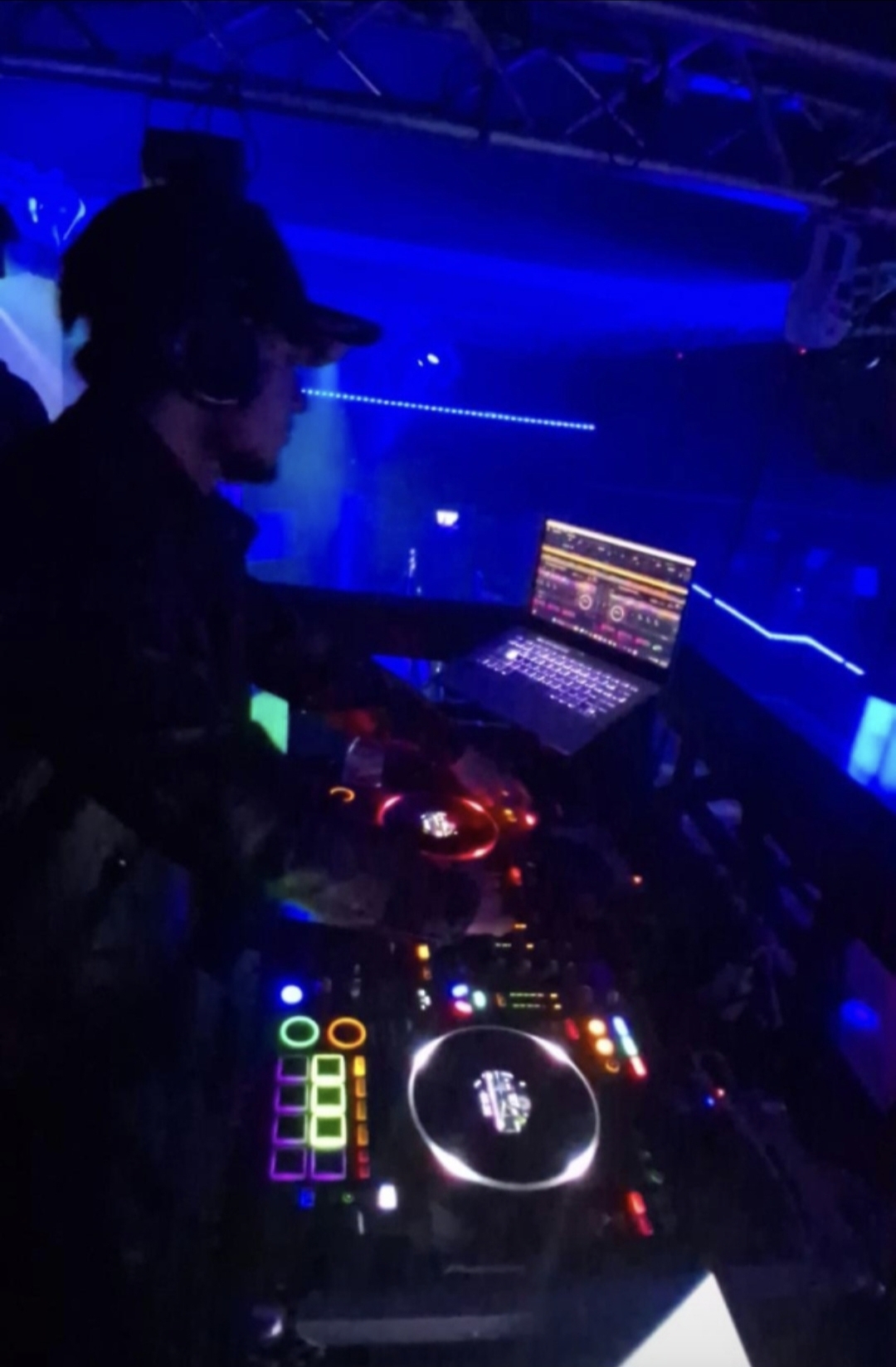 College student event with DJ performing