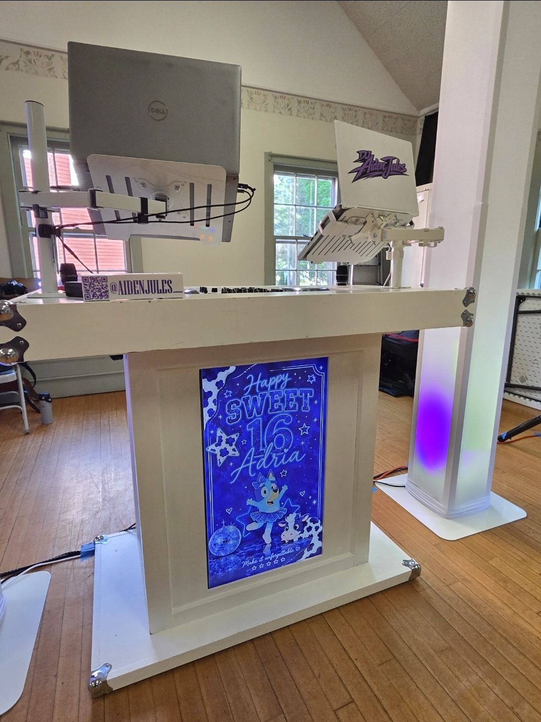 Custom lit DJ booth with 'Happy Sweet 16 Adria' marquee panel