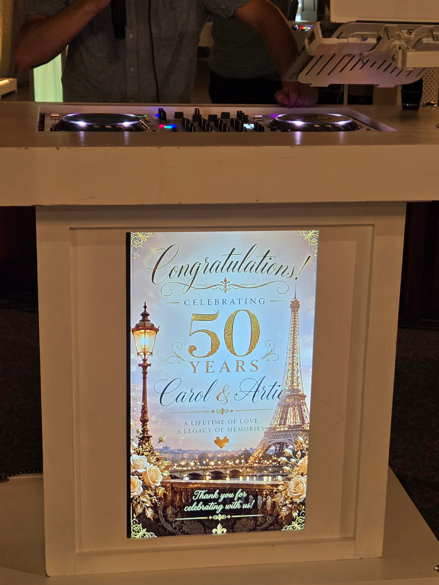 Custom DJ booth visuals displayed on an anniversary event front panel