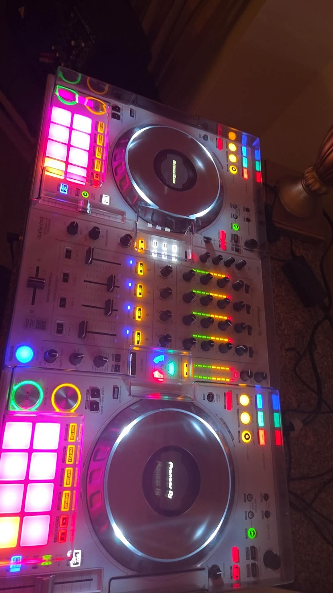 Professional DJ controller lit up before guests arrive